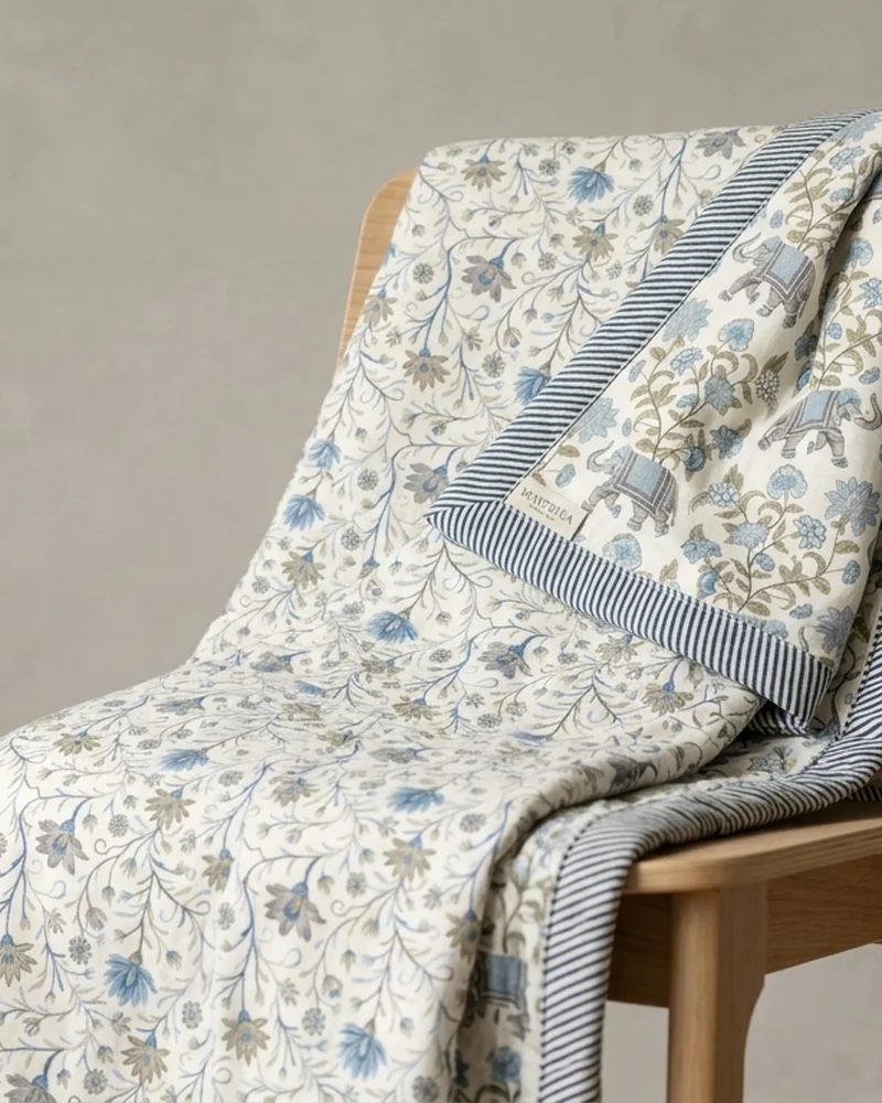 Reversible dohar draped over a wooden chair showing both prints, styled AI visualisation