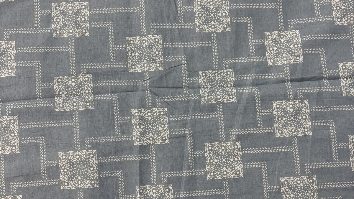 Close-up of the steel-blue reverse with a white bandhani-square pattern
