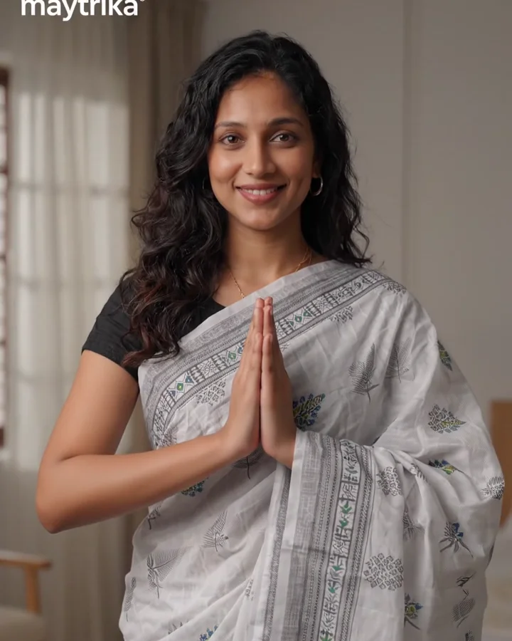 Maytrika presenter in a namaste, draped in the Subhaarambh cotton bedsheet